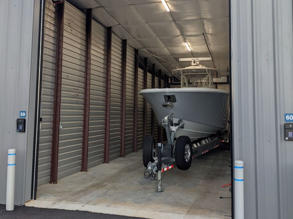 Center console boat securely stored outdoors at Titan Storage in Spanish Fort, Alabama, providing protection for boats.