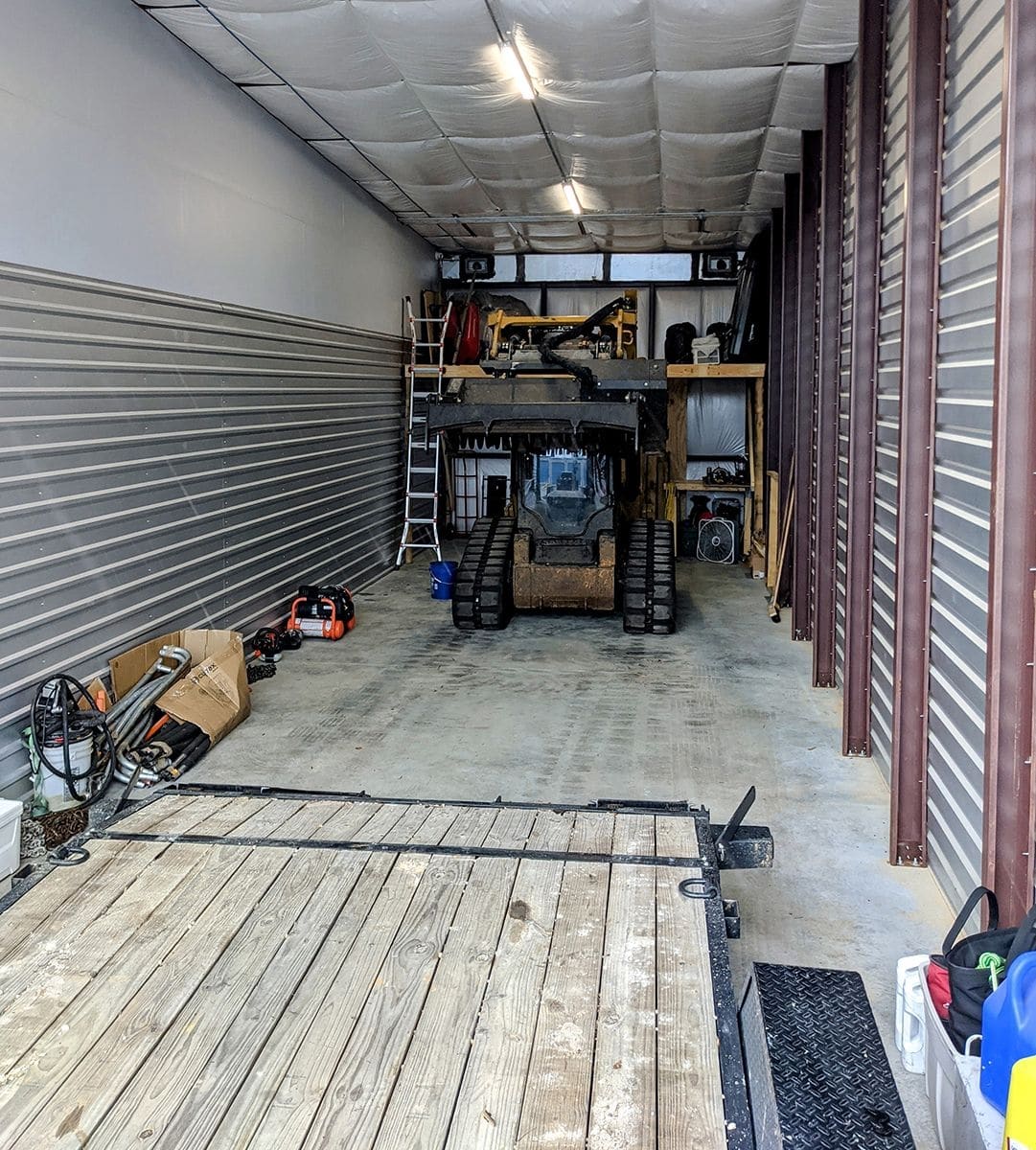 Heavy equipment, including a Bobcat, securely stored at Titan Storage in Spanish Fort, Alabama.